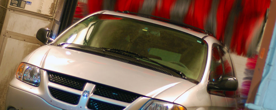 Image showing VEMA light duty vehicle van going through a car wash